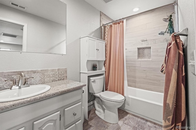 4942 Grove St, Denver, CO 80221 - full bath with vanity, toilet, shower / tub combo, and visible vents