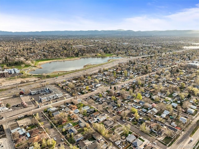 4942 Grove St, Denver, CO 80221 - birds eye view of property with a water and mountain view