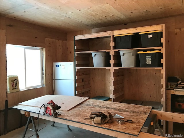 4942 Grove St, Denver, CO 80221 - kitchen with freestanding refrigerator and wood walls