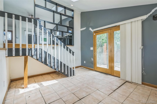 18 Clover Cir, Colorado Springs, CO 80906 - entrance foyer with lofted ceiling, tile patterned floors, and stairs
