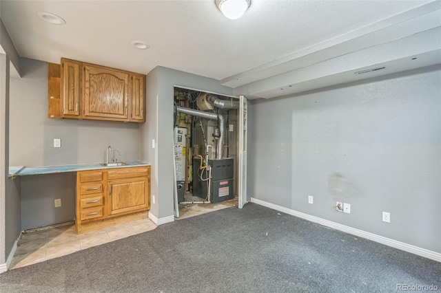 18 Clover Cir, Colorado Springs, CO 80906 - bar featuring light carpet, heating unit, light tile patterned floors, and water heater