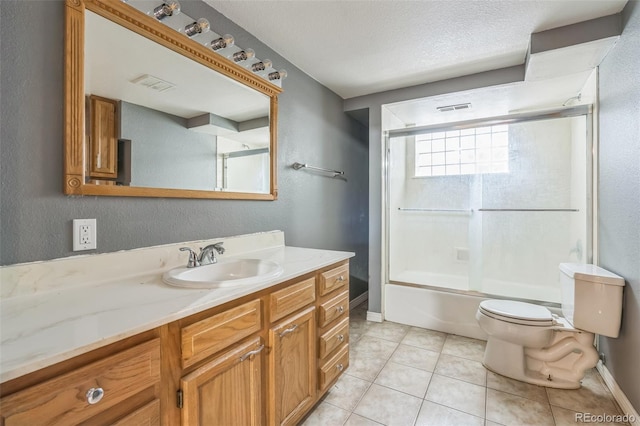 18 Clover Cir, Colorado Springs, CO 80906 - bathroom featuring vanity, combined bath / shower with glass door, tile patterned flooring, a textured wall, and a textured ceiling