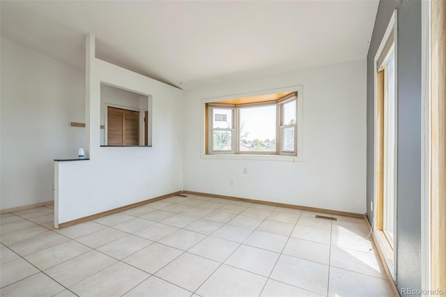18 Clover Cir, Colorado Springs, CO 80906 - empty room with light tile patterned flooring and baseboards