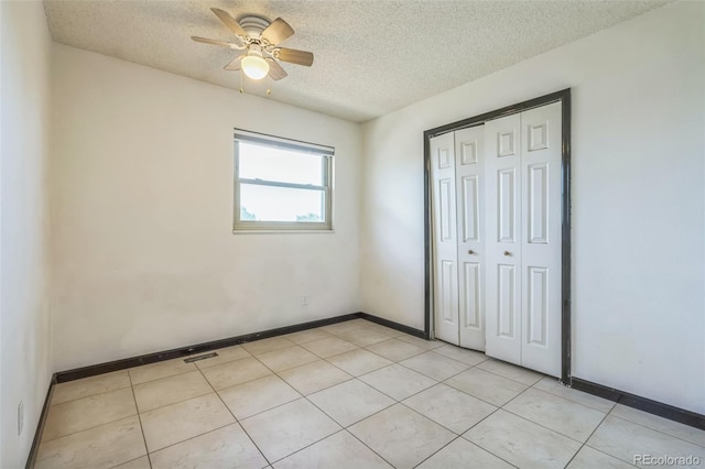 18 Clover Cir, Colorado Springs, CO 80906 - unfurnished bedroom featuring a textured ceiling, a closet, and ceiling fan