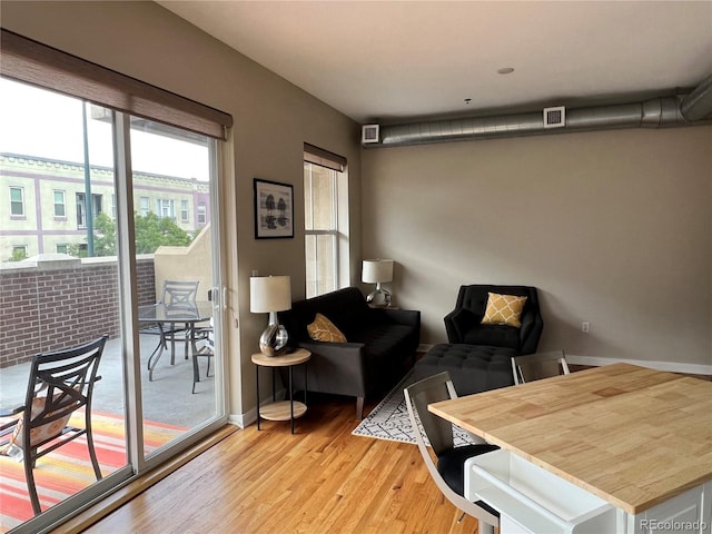 1441 Central Unit 305, Denver, CO 80211 - living room featuring light wood-style flooring and baseboards