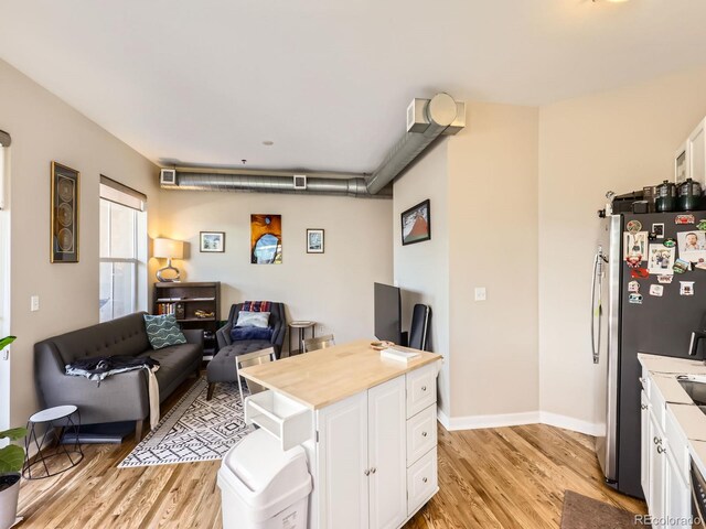 1441 Central Unit 305, Denver, CO 80211 - living area featuring light wood-style floors and an office area