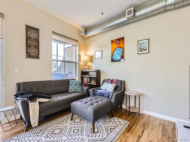 1441 Central Unit 305, Denver, CO 80211 - living area with wood finished floors and baseboards