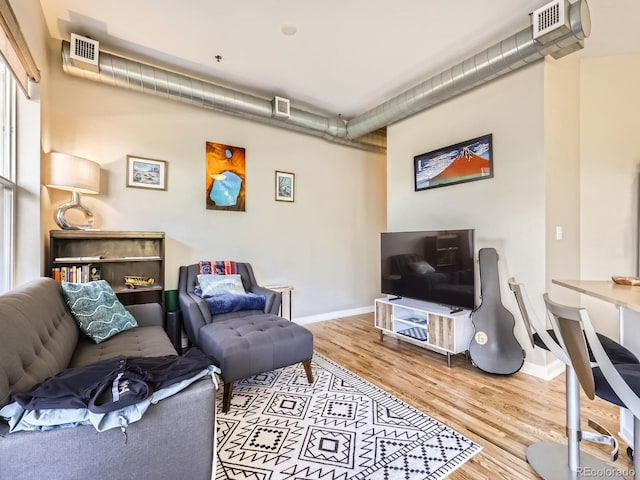 1441 Central Unit 305, Denver, CO 80211 - living area with baseboards and wood finished floors