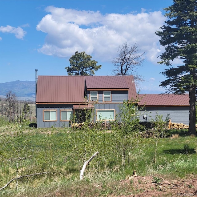 1034 Van Fossan Ln, Fort Garland, CO 81133 - view of front facade featuring metal roof, board and batten siding, and a mountain view
