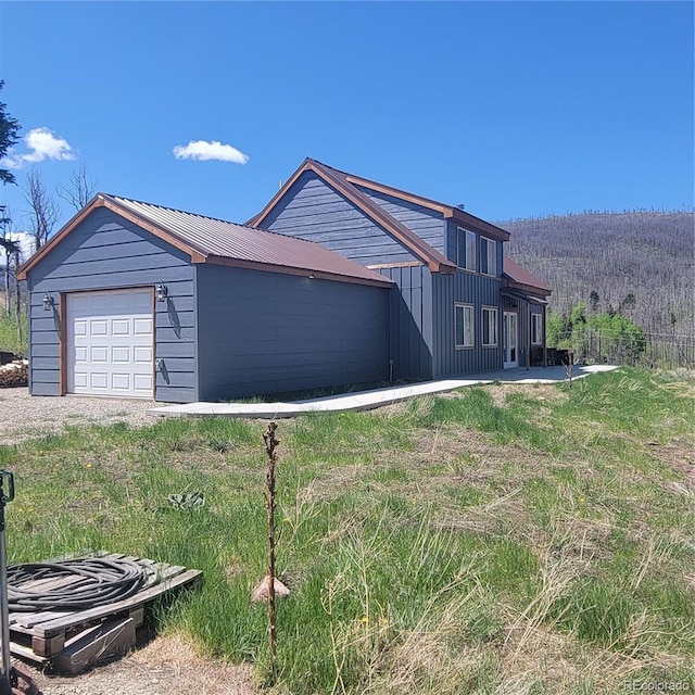 1034 Van Fossan Ln, Fort Garland, CO 81133 - view of property exterior featuring board and batten siding and metal roof