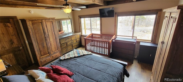 1034 Van Fossan Ln, Fort Garland, CO 81133 - bedroom with light wood-style flooring and wooden ceiling with exposed beams