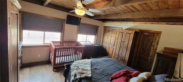 1034 Van Fossan Ln, Fort Garland, CO 81133 - bedroom with wooden ceiling with exposed beams, wood finished floors, and baseboards
