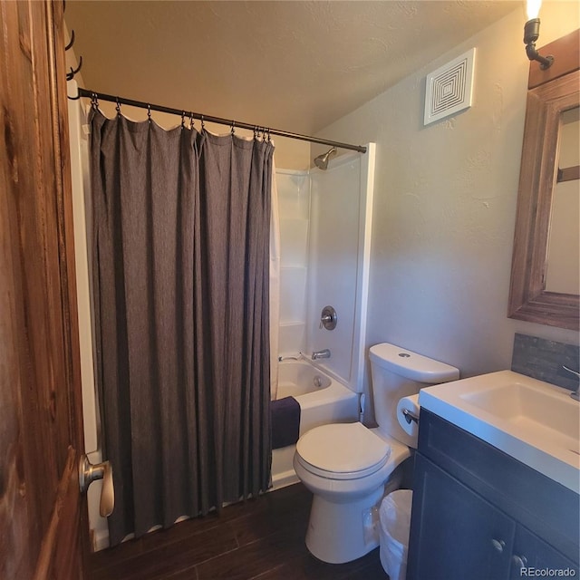 1034 Van Fossan Ln, Fort Garland, CO 81133 - full bathroom featuring toilet, vanity, shower / bath combination with curtain, and wood finished floors