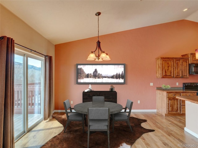 121 M And M Ln Unit 6C, Salida, CO 81201 - dining area with baseboards, lofted ceiling, light wood-type flooring, and an inviting chandelier