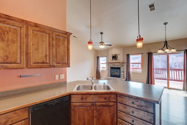121 M And M Ln Unit 6C, Salida, CO 81201 - kitchen with black dishwasher, a sink, a ceiling fan, a peninsula, and a stone fireplace