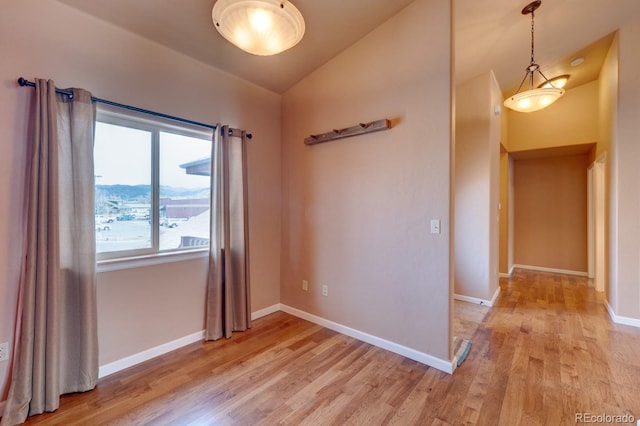 121 M And M Ln Unit 6C, Salida, CO 81201 - unfurnished room with baseboards, vaulted ceiling, and light wood finished floors