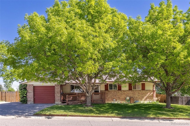 view of front of home with a garage and a front yard