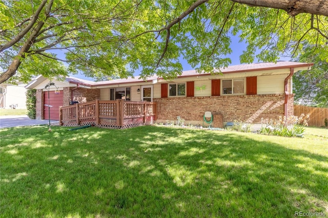 ranch-style house with a wooden deck and a front lawn