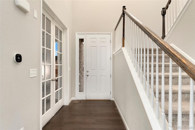 interior space featuring french doors and dark hardwood / wood-style flooring