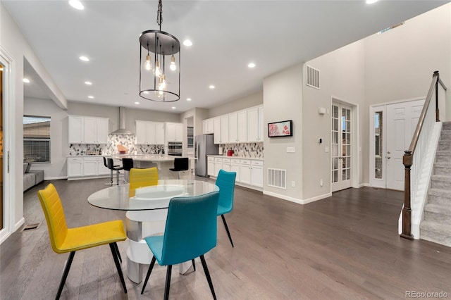 dining space with dark hardwood / wood-style floors