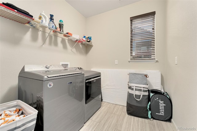 laundry room with independent washer and dryer