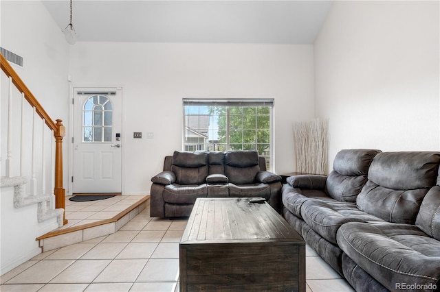 20835 E 47th Ave, Denver, CO 80249 - living room with stairway, light tile patterned flooring, a high ceiling, and visible vents