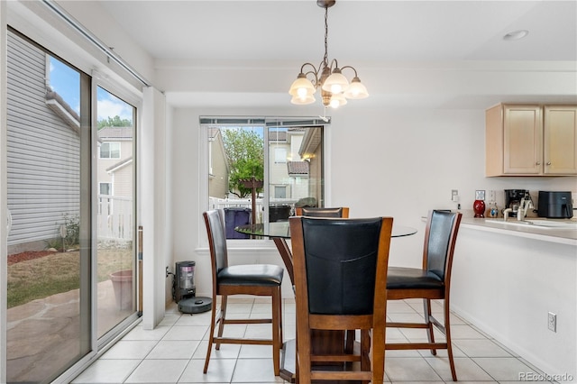 20835 E 47th Ave, Denver, CO 80249 - dining space with an inviting chandelier and light tile patterned floors
