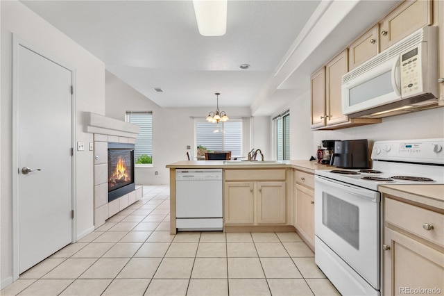 20835 E 47th Ave, Denver, CO 80249 - kitchen featuring a peninsula, white appliances, light tile patterned floors, and a chandelier