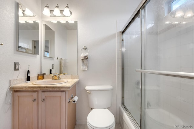 20835 E 47th Ave, Denver, CO 80249 - bathroom featuring toilet, enclosed tub / shower combo, and vanity