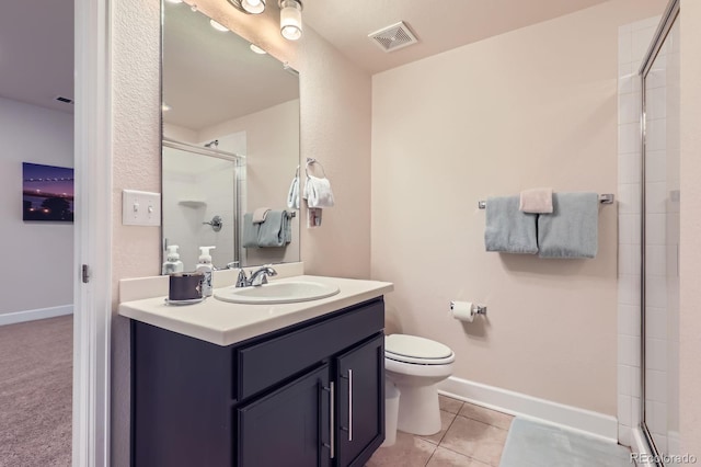 12578 Hudson Ct, Thornton, CO 80241 - bathroom with vanity, a shower with shower door, toilet, tile patterned flooring, and baseboards
