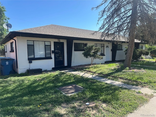 6671 E 73rd Pl, Commerce City, CO 80022 - single story home featuring a front lawn, stucco siding, and roof with shingles