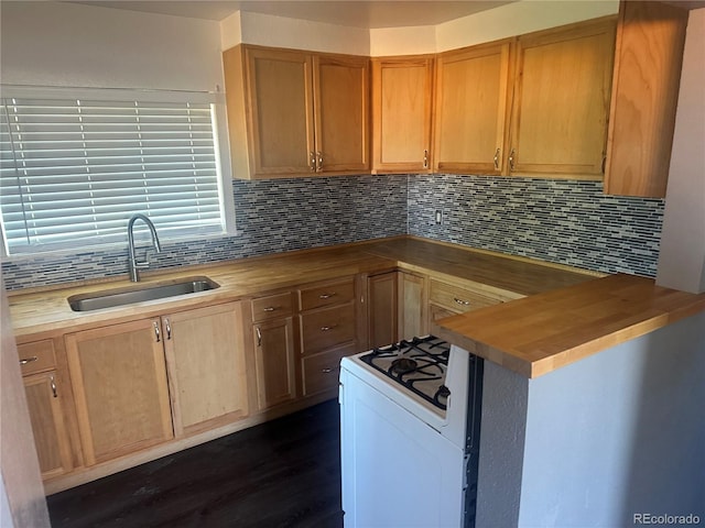6671 E 73rd Pl, Commerce City, CO 80022 - kitchen with wooden counters, decorative backsplash, dark wood-style flooring, and white gas range
