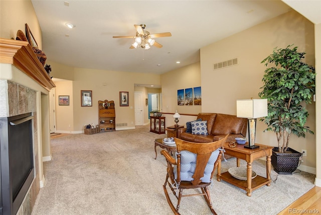 living area featuring visible vents, baseboards, ceiling fan, a fireplace, and recessed lighting