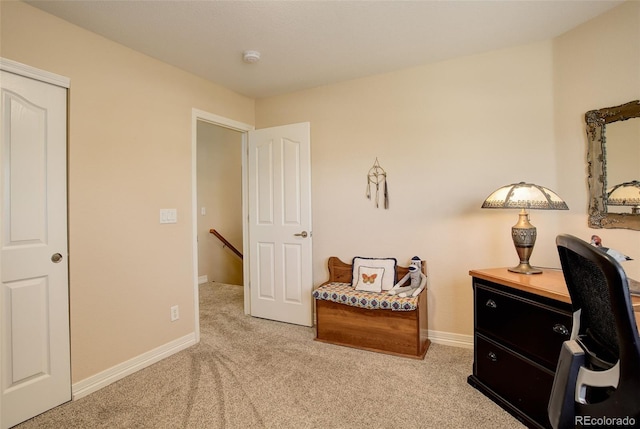 interior space with baseboards, carpet, and an upstairs landing