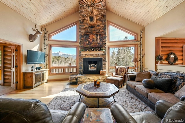 living room featuring high vaulted ceiling, light wood-type flooring, and wooden ceiling