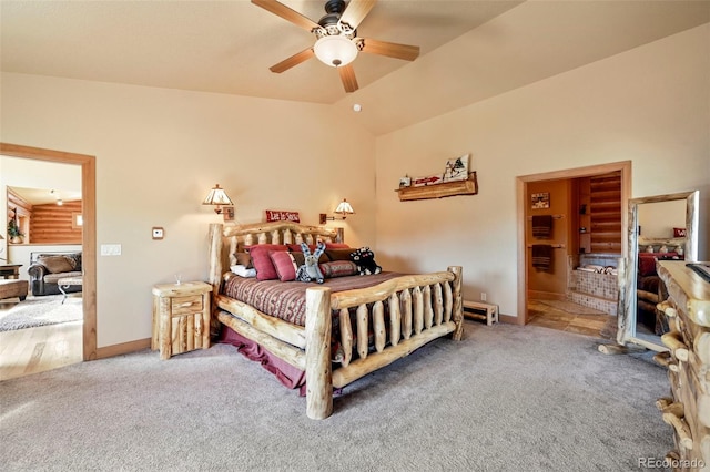 carpeted bedroom with vaulted ceiling, a ceiling fan, and baseboards