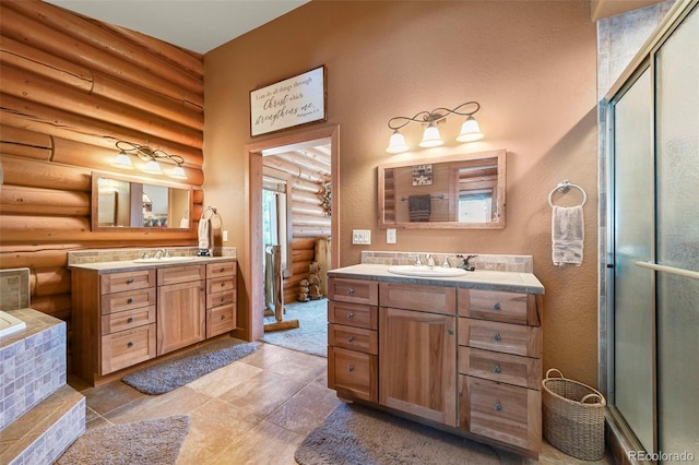 bathroom with rustic walls, two vanities, and a sink