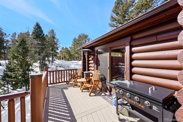 view of snow covered deck