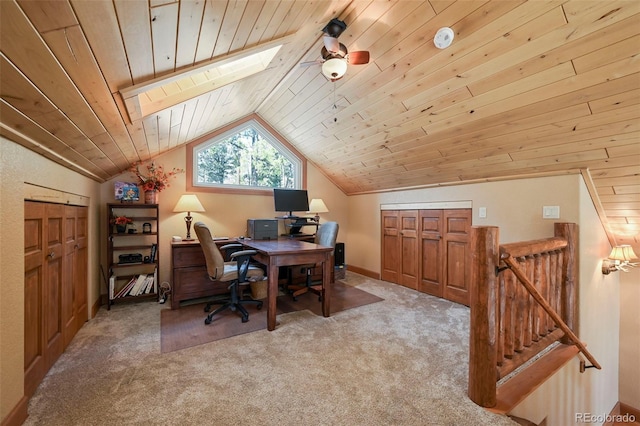 office space featuring wooden ceiling, vaulted ceiling with skylight, and light colored carpet