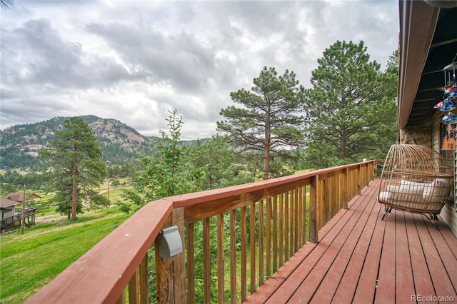 wooden deck featuring a mountain view