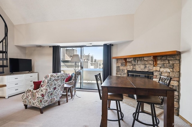 5250 S Huron Way Unit 5-308, Littleton, CO 80120 - dining area featuring light carpet and a stone fireplace