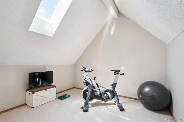 5250 S Huron Way Unit 5-308, Littleton, CO 80120 - exercise room featuring a skylight, vaulted ceiling, carpet flooring, and a textured ceiling