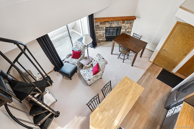 5250 S Huron Way Unit 5-308, Littleton, CO 80120 - living area with wood-type flooring, a fireplace, and stairs
