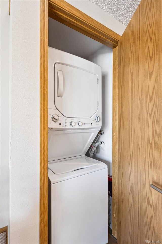 5250 S Huron Way Unit 5-308, Littleton, CO 80120 - laundry area with stacked washer and clothes dryer