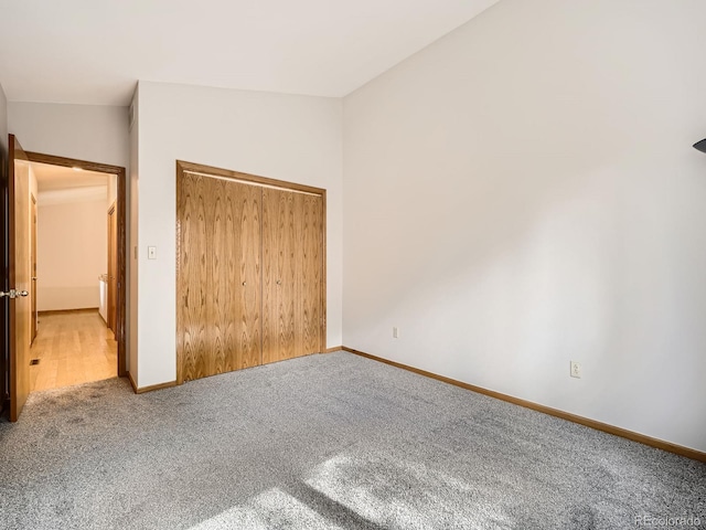 9670 W 69th Ave, Arvada, CO 80004 - unfurnished bedroom featuring carpet floors, baseboards, and a closet