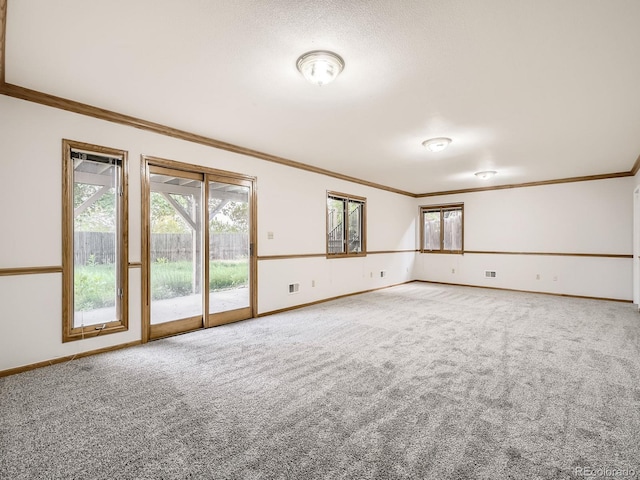 9670 W 69th Ave, Arvada, CO 80004 - carpeted spare room with crown molding, baseboards, and plenty of natural light