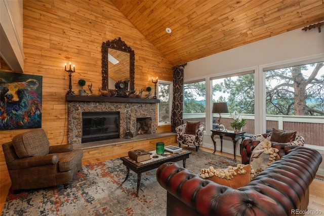 1854 Foothills Dr S, Golden, CO 80401 - living room featuring high vaulted ceiling, a fireplace, wood ceiling, wood finished floors, and wooden walls