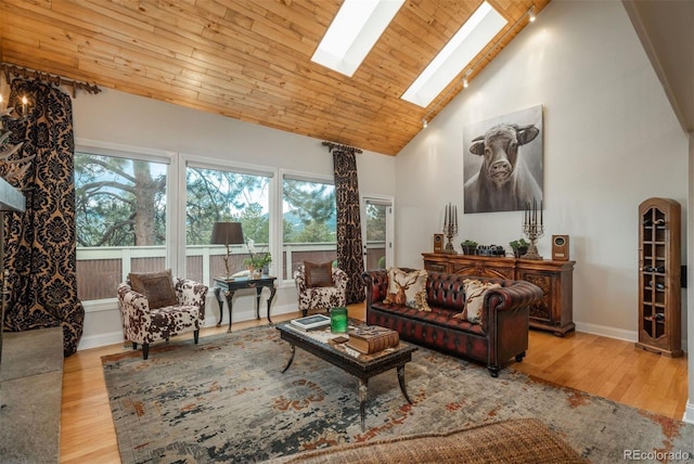1854 Foothills Dr S, Golden, CO 80401 - living room featuring a wealth of natural light, high vaulted ceiling, a skylight, and wood finished floors