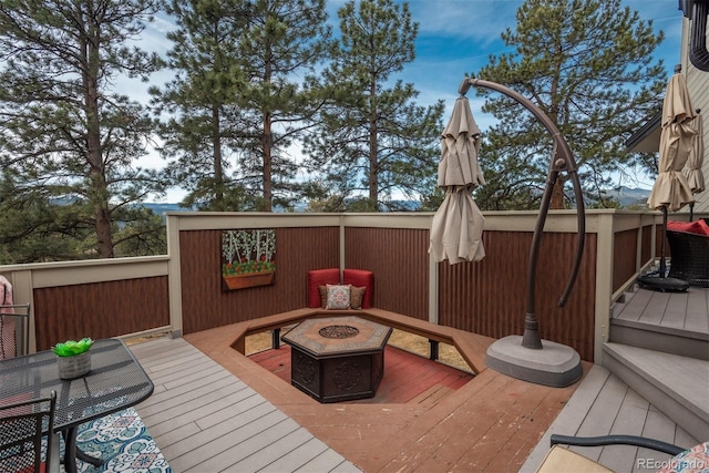 1854 Foothills Dr S, Golden, CO 80401 - wooden deck featuring an outdoor fire pit