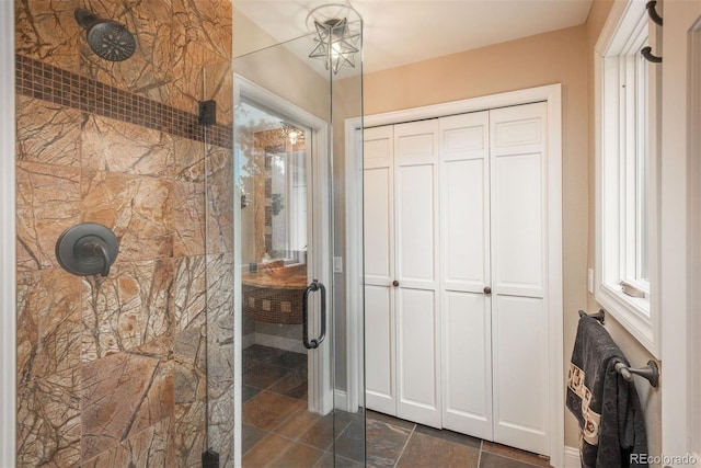 1854 Foothills Dr S, Golden, CO 80401 - bathroom featuring tiled shower and stone finish flooring